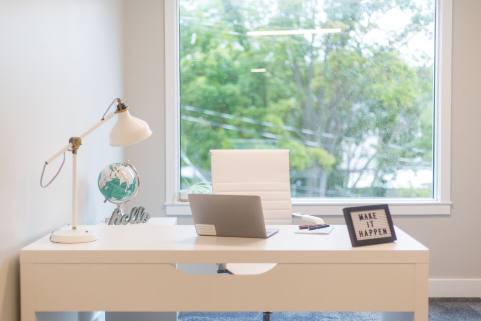A quiet home-office desk with a laptop